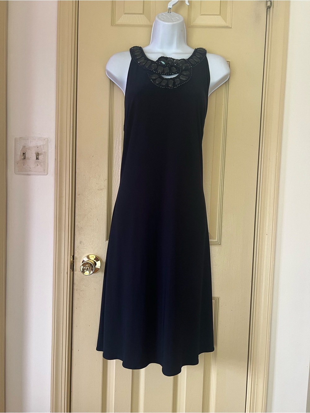Cachet Black Sleeveless Midi Dress with Beaded Neckline